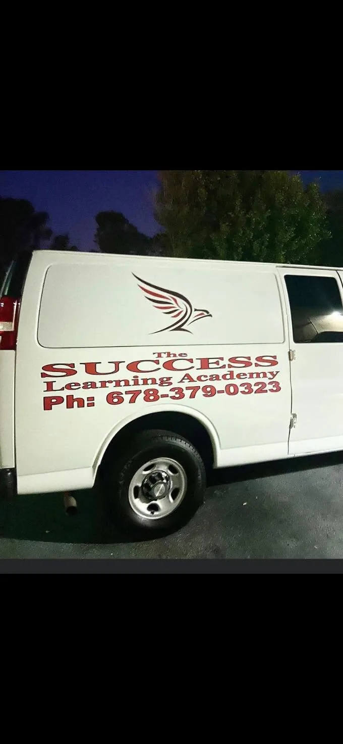 Service van with vinyl lettering by Fontz Graphics Designs