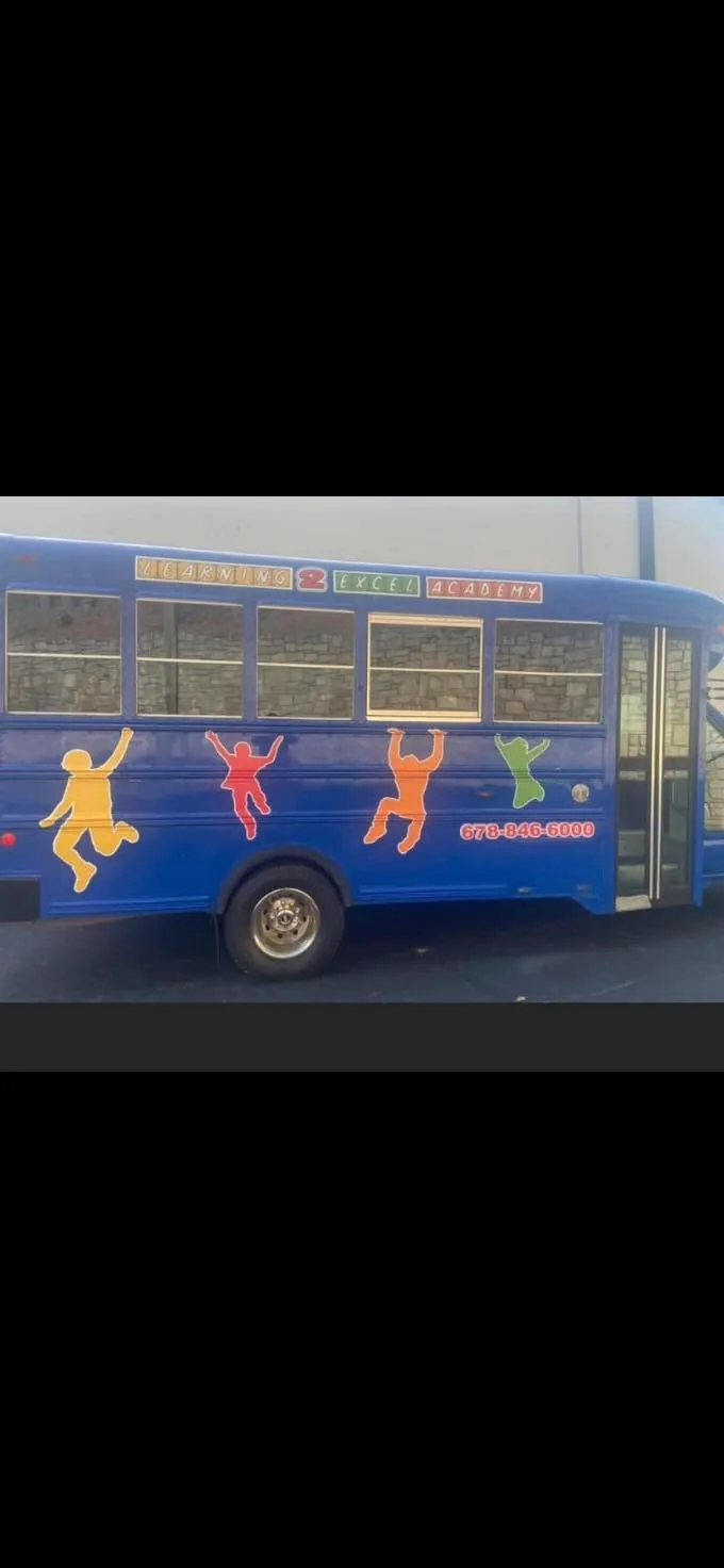 School bus fully wrapped with brand graphics by Fontz Graphics Designs