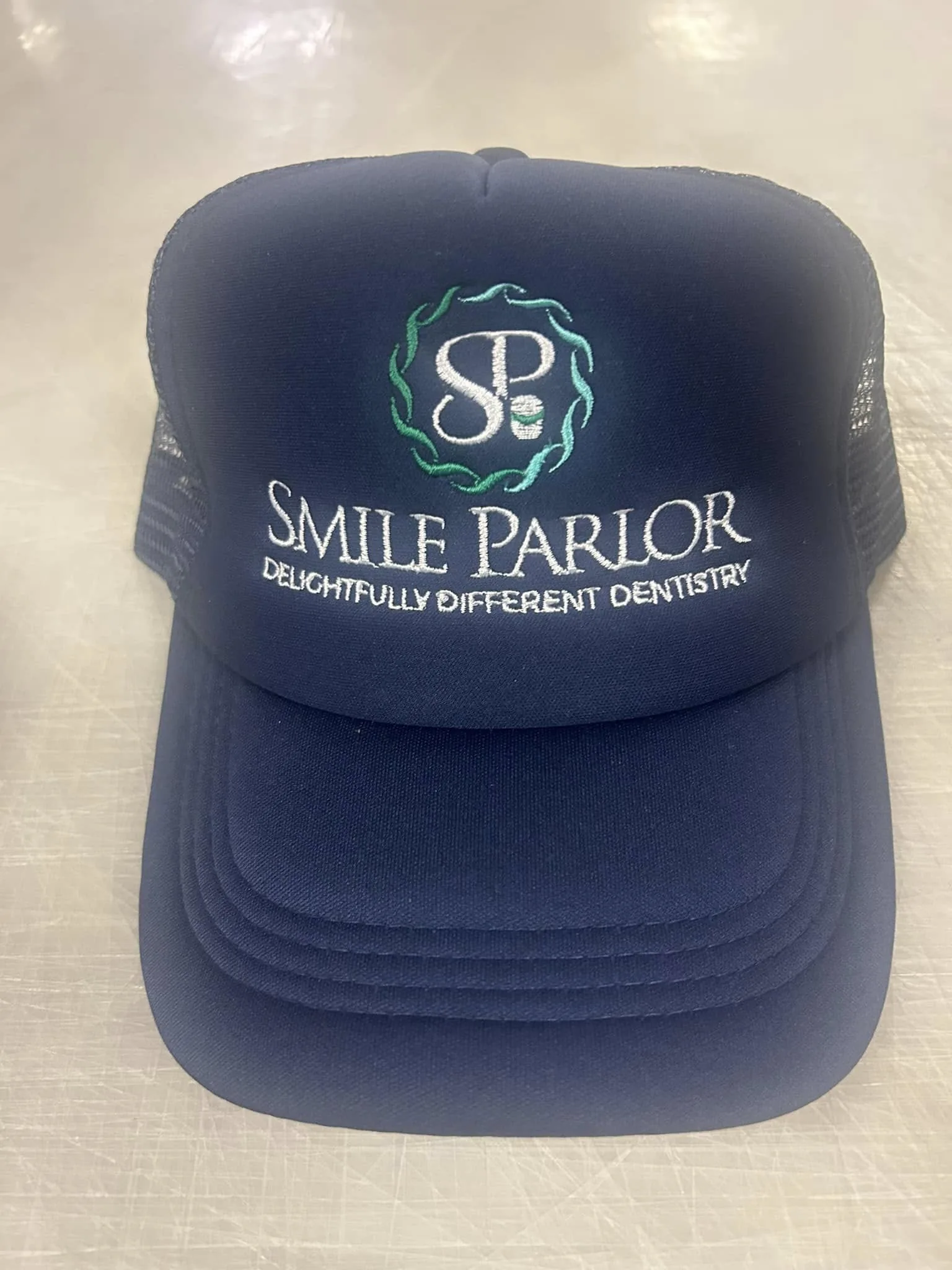 Custom embroidered promotional trucker hat by Fontz Graphics Designs