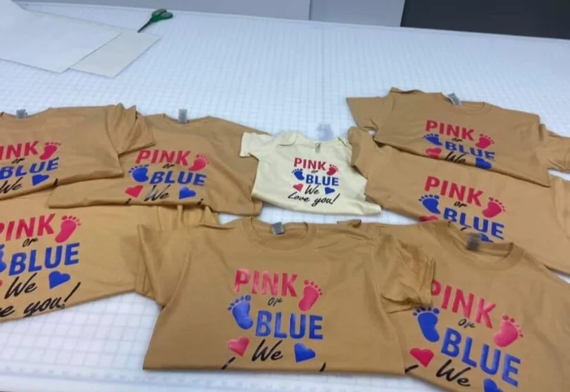 Custom printed t-shirts for a gender reveal celebration by Fontz Graphics Designs